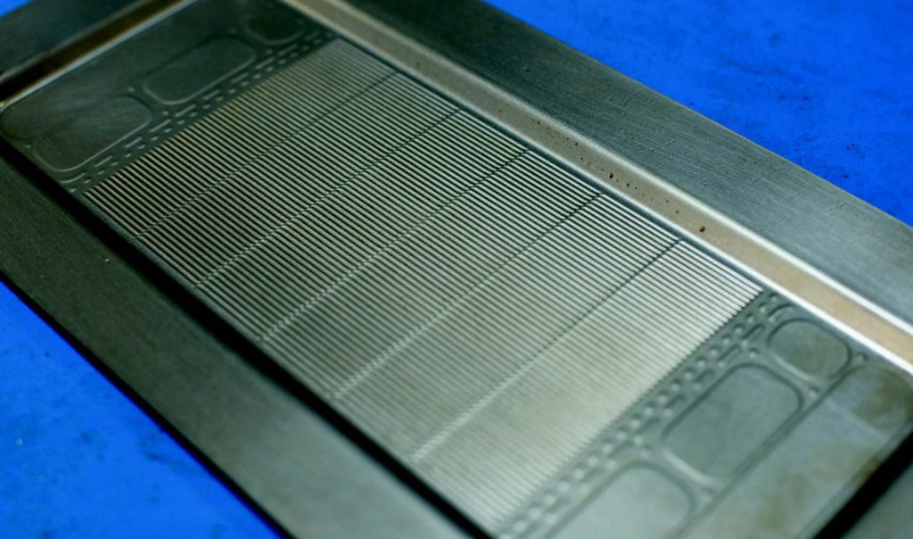 Microchannel heat exchanger prototype formed by FluidForming sheet metal hydroforming. Image courtesy of FluidFormingAmericas, LLC.