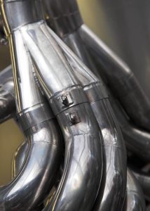 Stainless-steel exhaust system from a racing car.