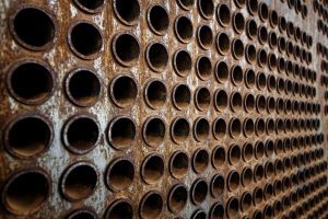 Rust tube sheet of the heat exchanger due for maintenance.